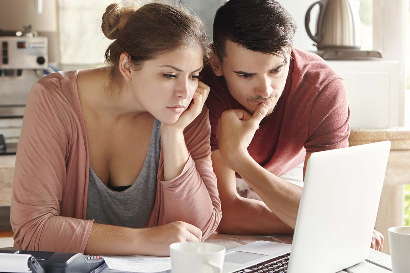 Young man and woman looking at a laptop screen