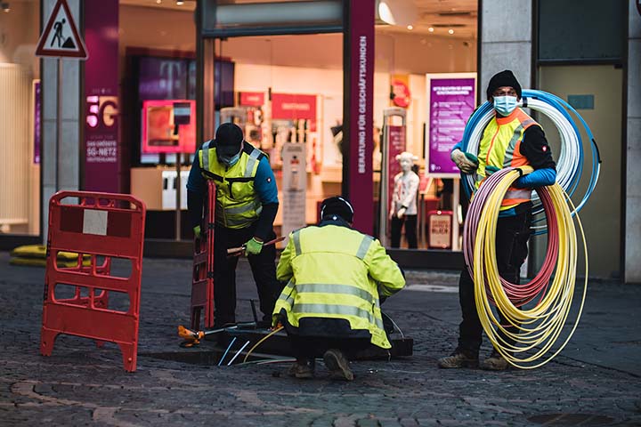 construction crew installing broadband internet at mall